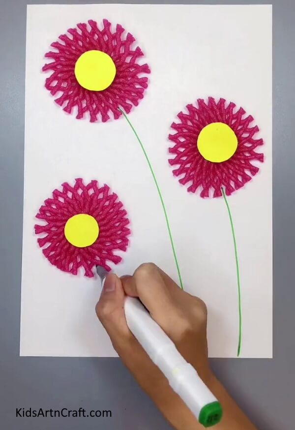 Drawing The Stems Of Flowers - Creating a decoration with fruit foam net and flowers from the comfort of your home.