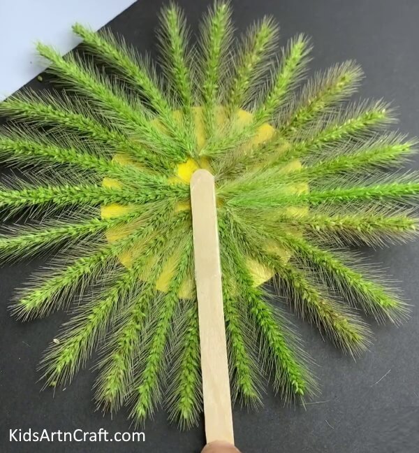 Pasting A Popsicle Stick- Creating a Green Wheat and Paper Lion for Kids