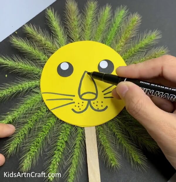 Drawing Nose, Smile, And Whiskers- Building a Paper Lion with Green Wheat for the Youngsters