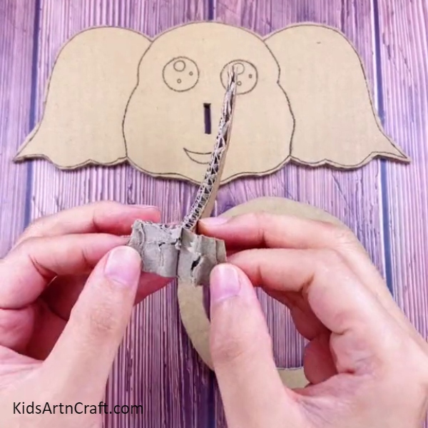 Splitting Trunk To Paste It With Elephant's Head-How to Make an Elephant Ring Toss Game that's Fun for Kids