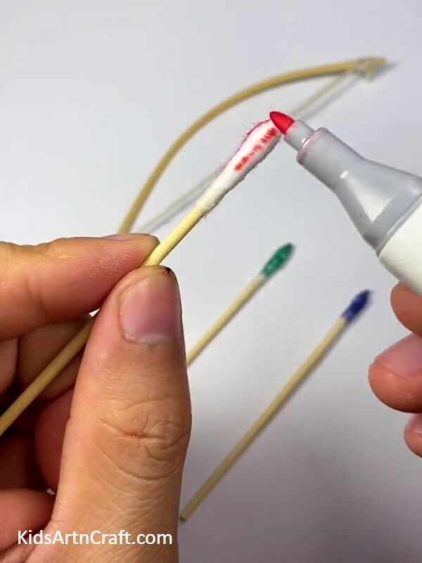 Paint the ends of the earbuds- Join in the fun and make a bow and arrow craft with children.