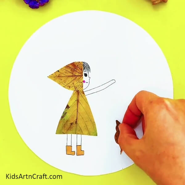 Making A Cat - Kid-friendly tutorial for constructing a girl and cat in the rain piece with leaves 