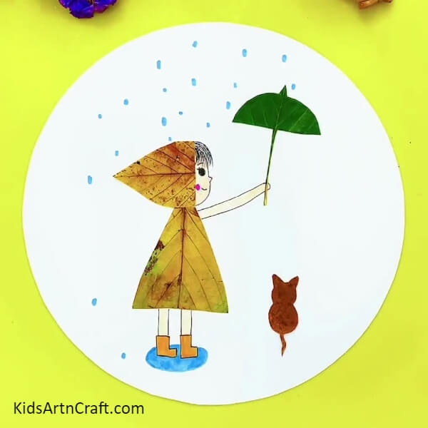 Your Girl And Cat In Rain Craft Are Ready! - Using leaves to craft a girl and cat in the rain project for children 