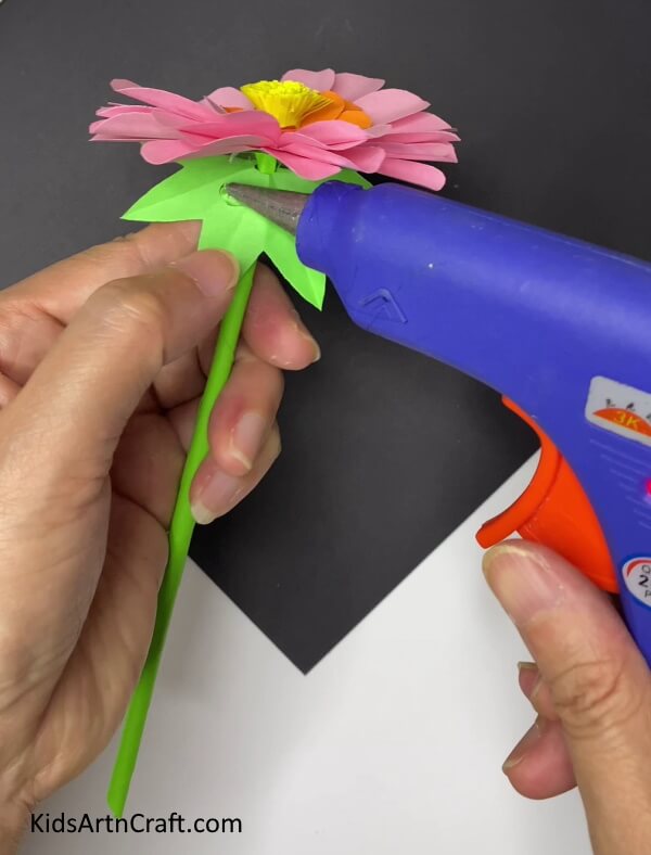 Applying Glue On The Sepals -Constructing Home Decor With Paper Blooms