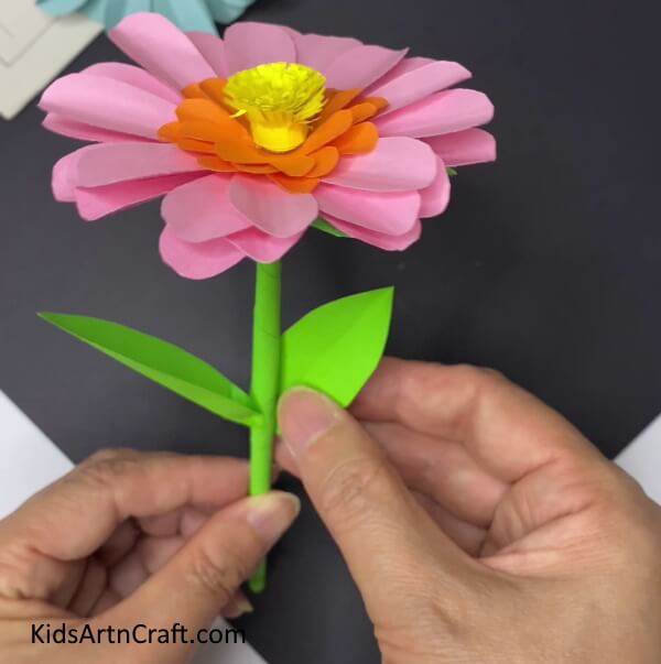 Adding Leaves To The Stem -Make a Paper Flower Decoration for your Home Yourself 