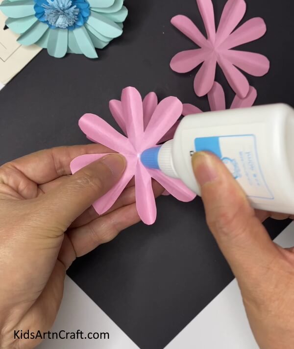 Pasting Two Pink Flowers Together -Crafting Home Accents With Paper Blossoms