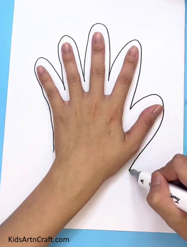 Tracing The Outline Of Hand On White Paper - Fingerprint fortress that is simple to sketch for children.