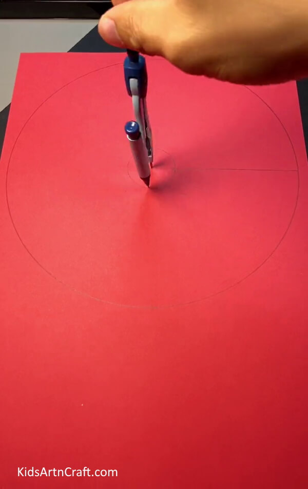 Drawing A Circle On Red Color Craft Paper - Constructing a 3D Mushroom out of paper and a plastic bottle
