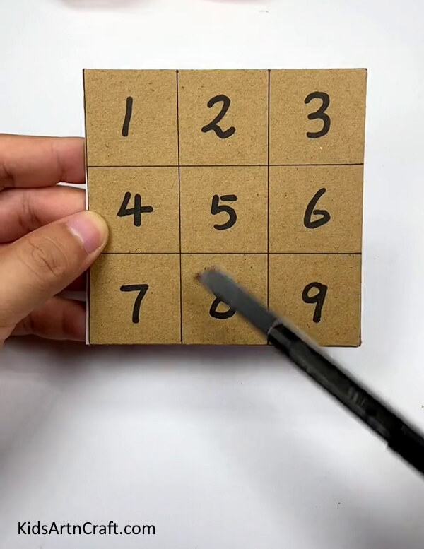 Cutting The Small Squares-Creating a cardboard puzzle at home