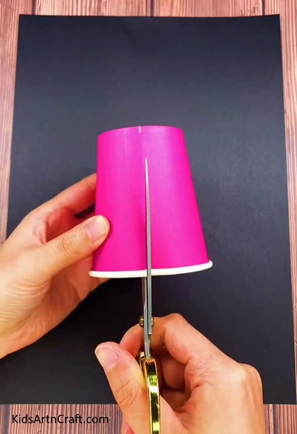 Cutting Strips Of Paper Cup - Here is a simple guide for making a Paper Cup Flower with children. 