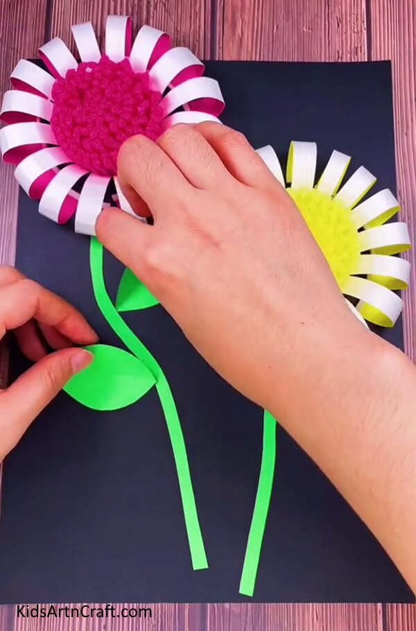Adding Leaves - Learn how to construct a Paper Cup Flower in a simple way for children