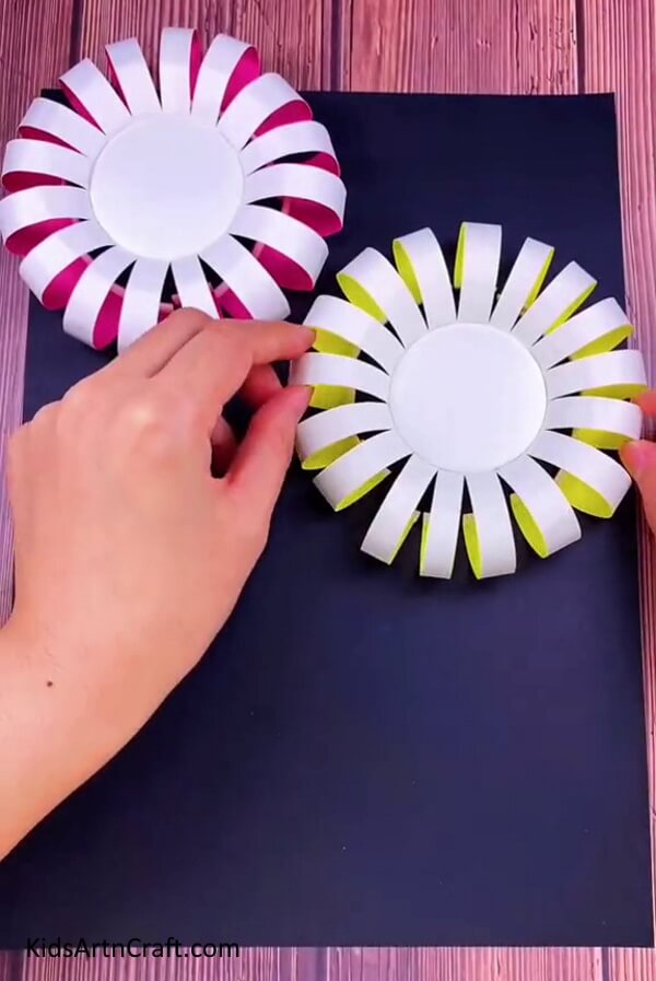 Adding Another Paper Cup Flower - A step-by-step guide to making a Paper Cup Flower with kids.