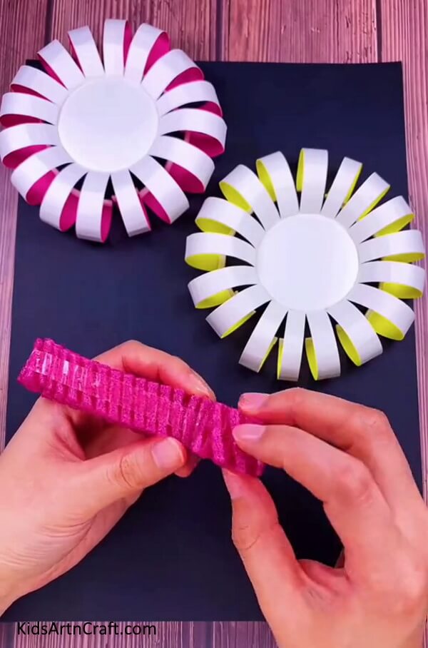 Applying Double-sided On Strip - A simple tutorial on how to craft a Paper Cup Flower with children. 