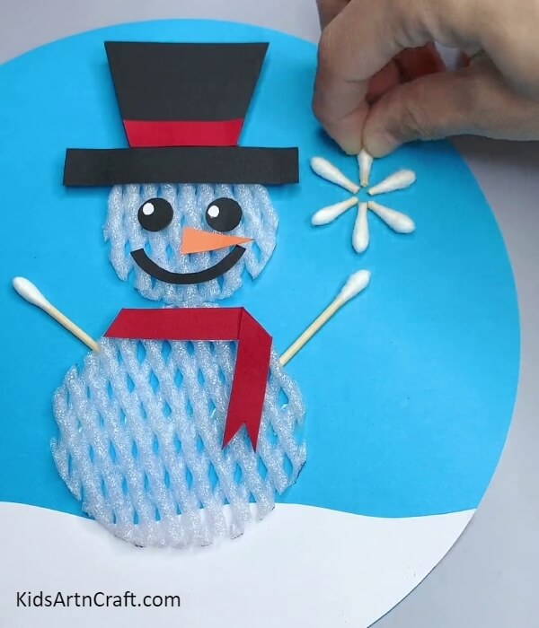 Making the Arms and Snowflakes - Create A Snowman Through The Use Of Fruit Foam And Earbuds