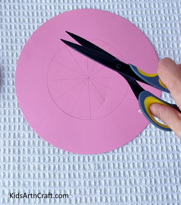 Cutting A Design Using The Drawn Lines- Assembling a summer hat with paper and clay for kids 