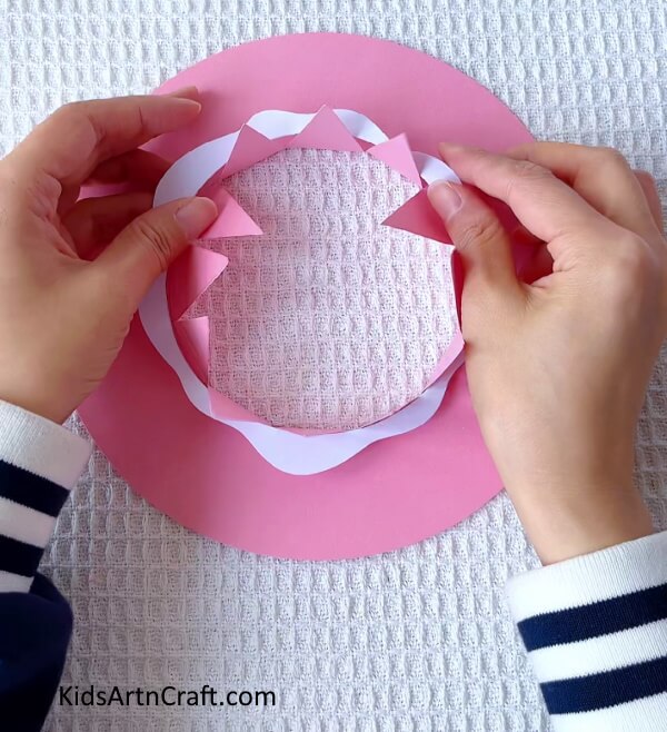 Sticking The Design- Producing a summer hat out of paper and clay for children 