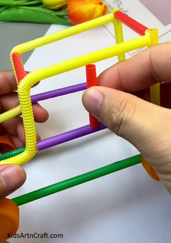Sticking More Straws To Form A Car-Here is a basic guide to building a Toy Car with a straw, perfect for kids