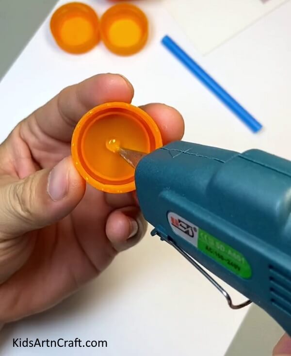 Applying Glue gun-Step-by-Step Guide for Children to Create a Toy Car with Straws