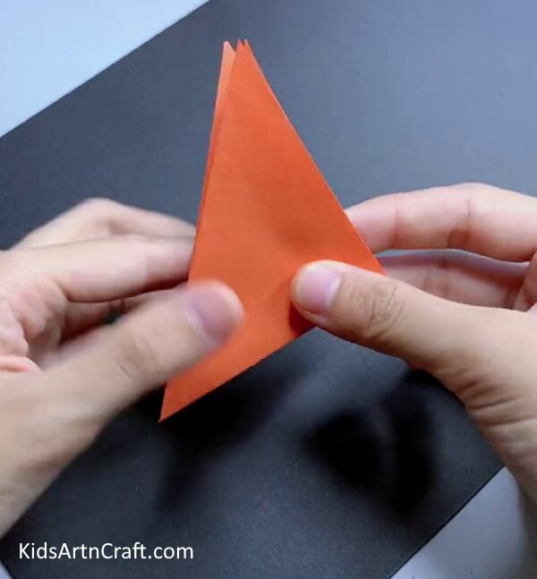 Fold The Orange Origami Paper Into Another Triangle How to Make an Origami Papercraft Fox for kids