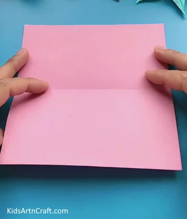 Folding Paper In Half-This tutorial will show kids how to construct a craft