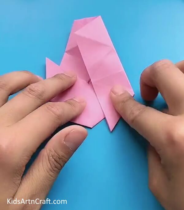 Repeating The Folds On The Right Side-A great way for kids to make a Star Flower with Origami is to follow this helpful tutorial