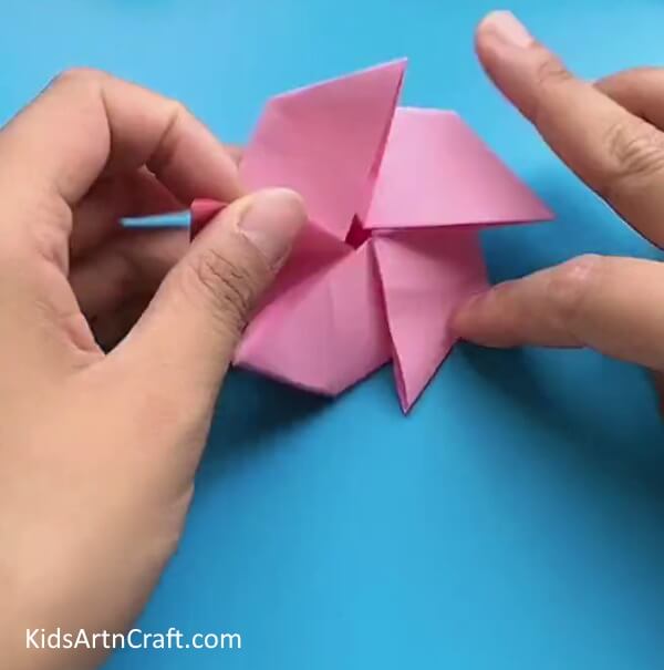 Repeating Folds On All Sides-Young ones will find this tutorial useful when they want to make a Star Flower with Origami