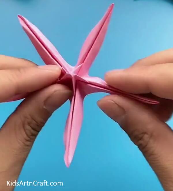Creating Locks Between Flaps-Learn how to fashion an Origami Flower with ease designed for children