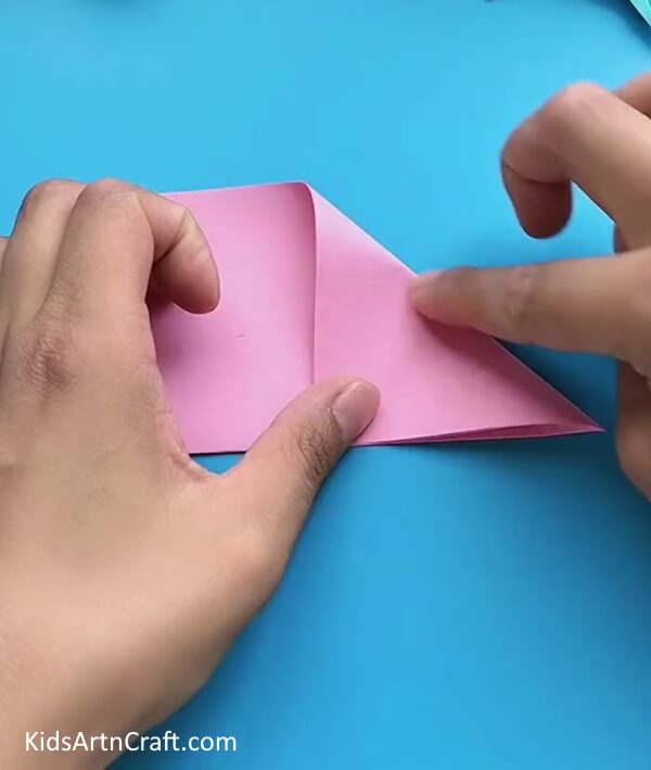 Folding Top Right Corner-An easy tutorial to help kids master the art of Origami