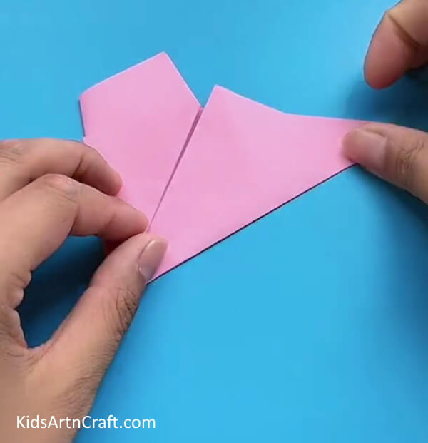 Folding Bottom Edge To The Diagonal Side-A guide for kids to create an Origami Craft