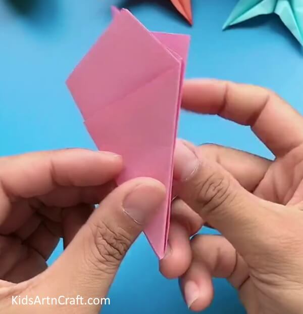 Folding In Half Outwards-Teach children the art of Origami with a tutorial on a Star Flower