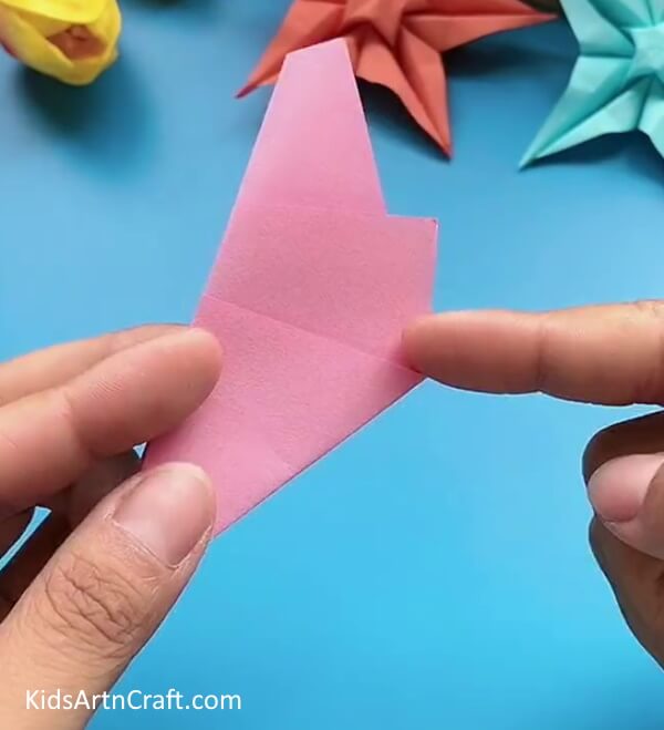 Cutting Paper-A simple tutorial for kids on the art of making a Star Flower with Origami 