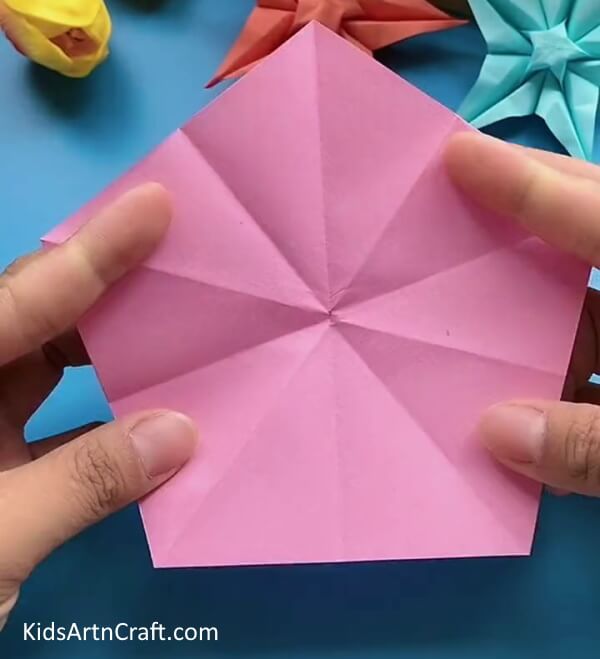 Unfolding Paper And Making Creases-Learn to produce a Star Flower using Origami, a tutorial for children