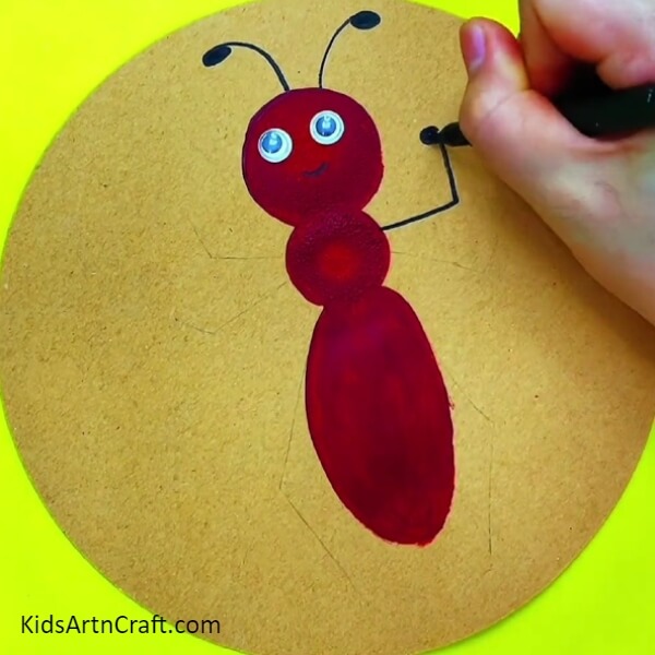 Draw the hands and legs of the ant then highlight it with a sketch pen or marker- A Step-by-Step Tutorial on Making an Ant