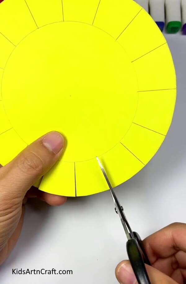 Cutting Lines-Steps for building a paper sun toy that can be activated with blowing
