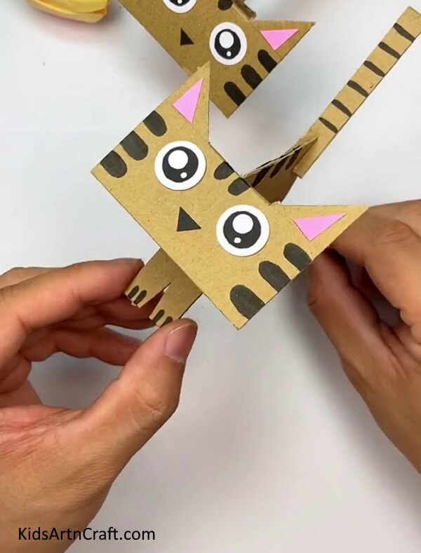 Drawing The Cat's Texture Over It-This guide gives a straightforward tutorial for children on how to make a Cardboard Cat