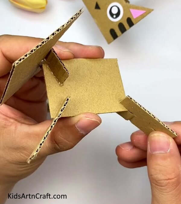 Making The Legs Of The Cat-This tutorial assists kids in making a Cardboard Cat with ease 