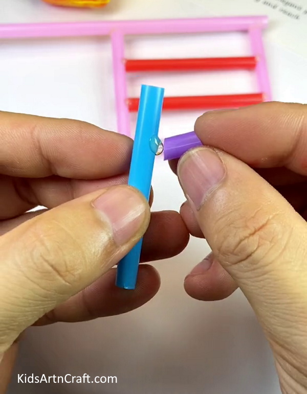 Using A Blue And A Purple Straw- Guide to Building a Cart with Plastic Straws 