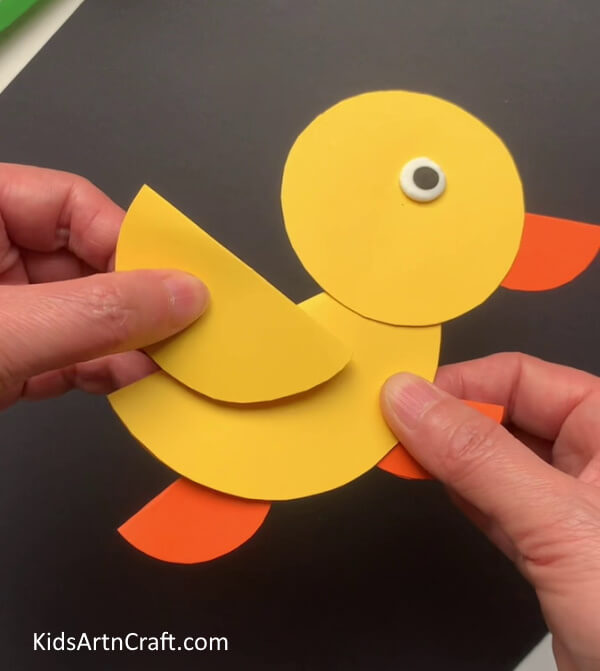 Making Wings Of Duck Assembling a duck from a round piece of paper