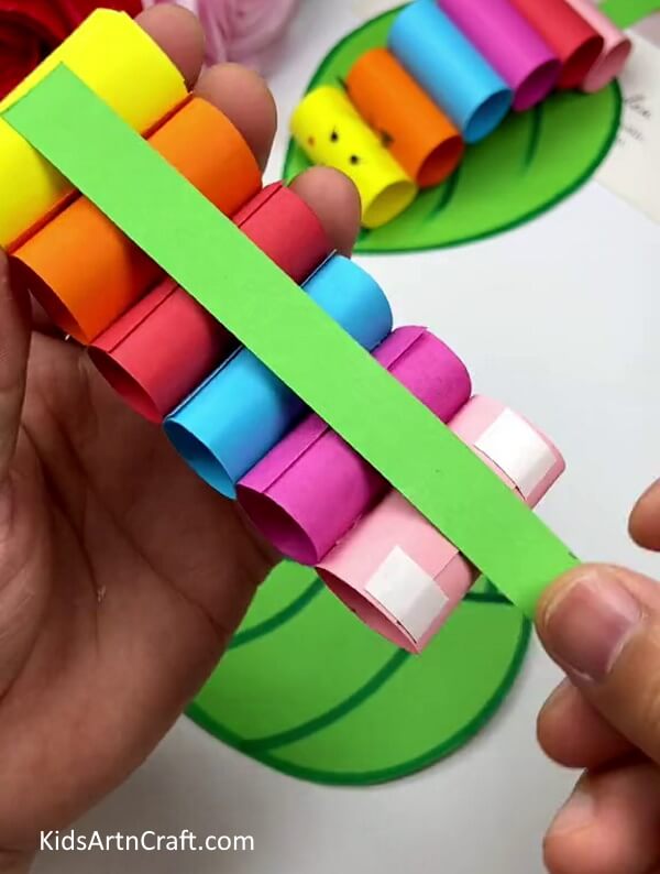 Stick a Strip of paper below your Caterpillar - Putting Together a Colorful Paper Caterpillar On a Blade