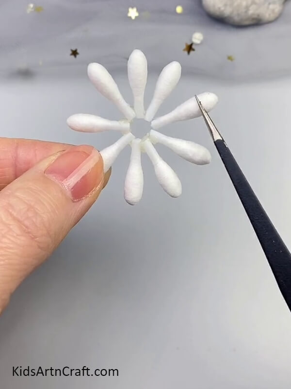 Stick All Earbuds In Circular Motion- Instructions for building cotton ear bud flowers 