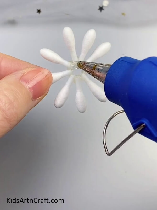 Apply Glue Gun in the Middle of the Earbuds- Crafting with cotton earbuds to produce floral designs