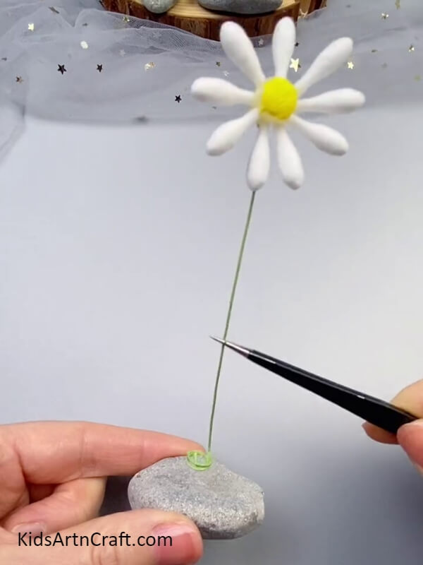 Placing The Stem Over The Stone- Step-by-step directions for making cotton earbud flowers