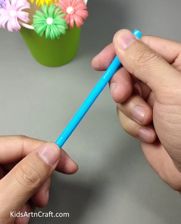 Taking A Colorful Drinking Straw And Stretch It Out-Creating Beverage Straw Blossoms for youngsters