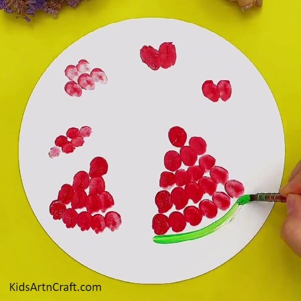 Make More Leaves With A Finger Impression-Instructing Kids To Make Fingerprint Watermelon Paintings