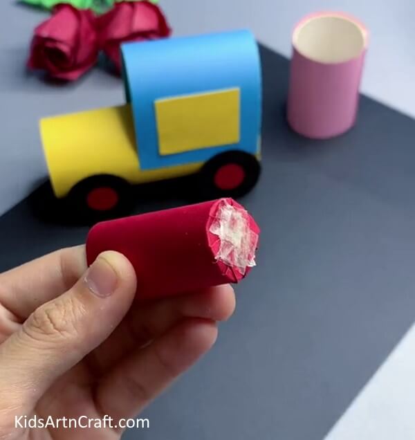 Closing The End Of Cylinder And Applying Tape - Children can have a great time building a paper train