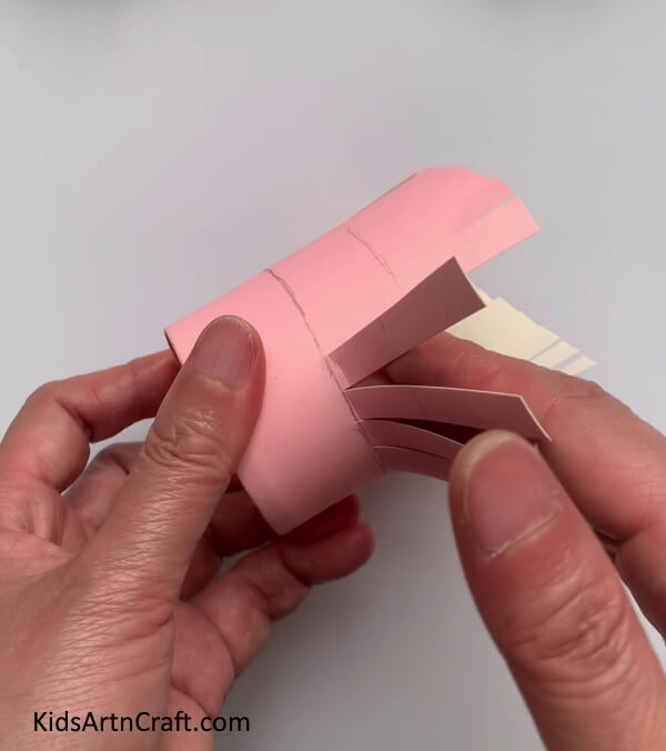Folding The Vertical Strips - Developing mini hats from paper cups for children 