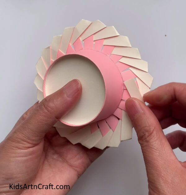 Securing The Ends - Manufacturing small hats from paper cups for children 