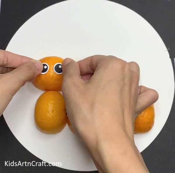 Making Eyes - Developing a Stunning Caterpillar Design from Orange Peels with Kids