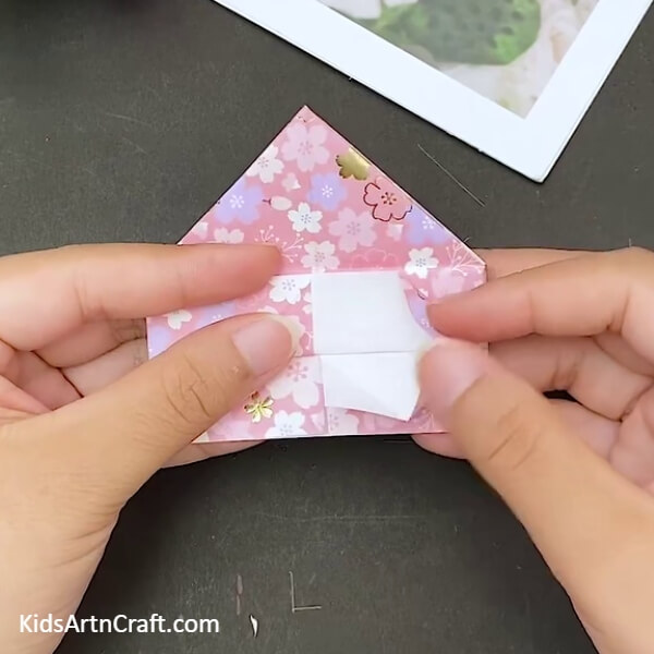 Make Folds On This Vertical Shape- Learn how to make a heart-shaped origami envelope with this tutorial