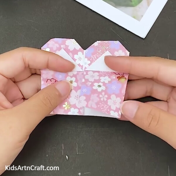 Turning The Folds Backward- Here is a step-by-step guide on how to make an Origami Heart Envelope. 
